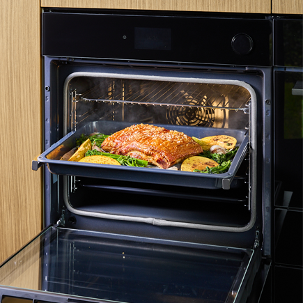 Oven with roast pork and pumpkin