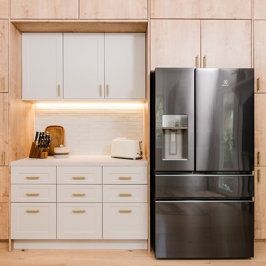 Modern home Electrolux fridge in cream coloured kitchen.